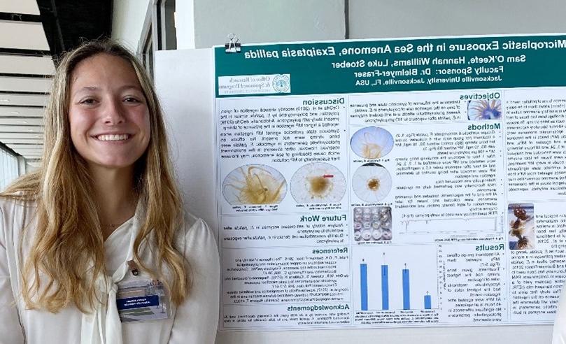 girl smiling in front of a presentation